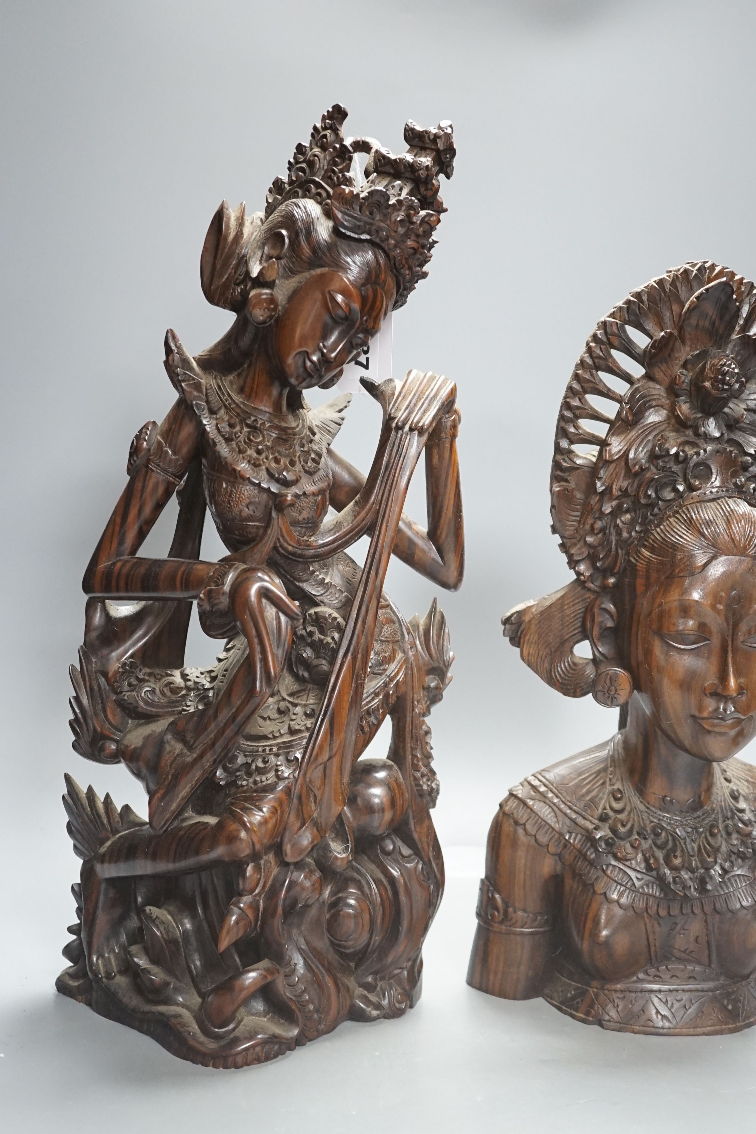 Three Balinese hardwood Macassar Ebony carvings, tallest 44.5 cm, two Chinese soapstone carvings and another